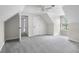 Large bedroom with neutral carpet, white trim, and multiple doorways creating an open, airy feel at 12383 S 25 W, Columbus, IN 47201