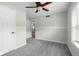Bedroom featuring a ceiling fan and light gray carpet and paint at 12383 S 25 W, Columbus, IN 47201