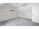 Bright bedroom features a ceiling fan, neutral carpet, and an airy atmosphere at 12383 S 25 W, Columbus, IN 47201
