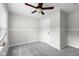 Bedroom with ceiling fan and neutral walls and carpet at 12383 S 25 W, Columbus, IN 47201
