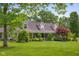 View of the home featuring an inviting front porch and beautiful yard at 12383 S 25 W, Columbus, IN 47201