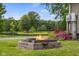 Backyard firepit with a view of the pond providing a serene and inviting outdoor space at 12383 S 25 W, Columbus, IN 47201