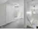 Hallway featuring carpet flooring, access to other rooms in the house, and a stairway at 12383 S 25 W, Columbus, IN 47201