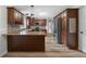 A kitchen with wood cabinets, stainless steel appliances, and stone countertops at 12383 S 25 W, Columbus, IN 47201