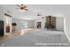 Open-concept living room features a stone fireplace and a large window with natural light at 12383 S 25 W, Columbus, IN 47201