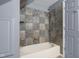 Bathroom featuring a tiled shower with a combination shower head and tub at 12383 S 25 W, Columbus, IN 47201
