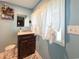 Charming bathroom with stylish vanity, patterned tile floor, and ample natural light at 12508 N Jackley Rd, Elwood, IN 46036
