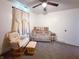Serene Bedroom with soft lighting, rocking chair, and charming wooden crib at 12508 N Jackley Rd, Elwood, IN 46036