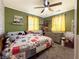 Inviting bedroom with whimsical decor, plush bedding, and abundant natural light at 12508 N Jackley Rd, Elwood, IN 46036
