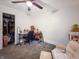 Functional bedroom with a work desk, comfortable chair, and ample closet space at 12508 N Jackley Rd, Elwood, IN 46036