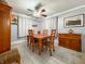 Bright dining room with a wood table and ceiling fan, perfect for Gathering meals and entertaining at 12508 N Jackley Rd, Elwood, IN 46036
