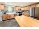 Open-concept kitchen featuring stainless steel appliances, a large island, and plenty of counter space at 12508 N Jackley Rd, Elwood, IN 46036