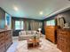 Comfortable living room featuring neutral tones, a plush sofa, and a stylish rug at 12508 N Jackley Rd, Elwood, IN 46036
