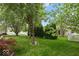 Beautiful backyard featuring lush greenery and mature trees, providing shade and privacy at 12624 Majestic Way, Fishers, IN 46037