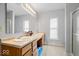 Bathroom featuring double sinks, a large mirror, and plenty of counter space at 12624 Majestic Way, Fishers, IN 46037