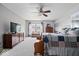 The bedroom features a ceiling fan, and a window with view of the outdoors at 12624 Majestic Way, Fishers, IN 46037