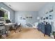 Bright home office featuring hardwood floors, soothing blue walls, and ample natural light at 12624 Majestic Way, Fishers, IN 46037