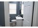 This bathroom features a modern vanity, toilet, and hardwood floors at 1331 N Berwick Ave, Indianapolis, IN 46222
