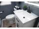 This bathroom features a modern vanity, toilet, and hardwood floors at 1331 N Berwick Ave, Indianapolis, IN 46222