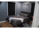 This bedroom features hardwood floors, a car-themed decor, and natural lighting at 1331 N Berwick Ave, Indianapolis, IN 46222