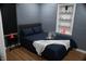 This bedroom features hardwood floors, a car-themed decor, and natural lighting at 1331 N Berwick Ave, Indianapolis, IN 46222