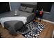 Modern bedroom featuring a gray bed, racing themed rug, and decorative racing accessories at 1331 N Berwick Ave, Indianapolis, IN 46222