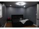 This bedroom features hardwood floors, a black bedset, and natural lighting at 1331 N Berwick Ave, Indianapolis, IN 46222
