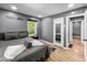 Bedroom with gray walls, hardwood flooring and two access doors at 1331 N Berwick Ave, Indianapolis, IN 46222