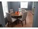 Open dining room design showcasing a wooden table and comfortable chairs next to the living room at 1331 N Berwick Ave, Indianapolis, IN 46222