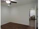 Spacious bedroom showcases hardwood flooring and doorway into the living area at 1352 W 22Nd St, Indianapolis, IN 46202