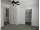 Bright bedroom with fresh paint and carpeting, showcasing an open closet space at 1352 W 22Nd St, Indianapolis, IN 46202