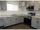 Modern kitchen with stainless steel appliances, granite countertops and grey cabinets at 1352 W 22Nd St, Indianapolis, IN 46202