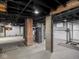 Unfinished basement with painted concrete walls and ceiling, ready for customization at 1617 E 52Nd St, Indianapolis, IN 46205