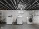 Basement laundry area with washer and dryer hookups, and an open, unfinished space at 1617 E 52Nd St, Indianapolis, IN 46205