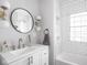 Bright bathroom with white subway tile, modern fixtures, and vanity at 1617 E 52Nd St, Indianapolis, IN 46205