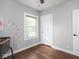 Bright bedroom featuring hardwood floors, a window letting in natural light and fresh paint at 1617 E 52Nd St, Indianapolis, IN 46205