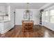 Dining room featuring hardwood floors, unique light fixture and ample natural light at 1617 E 52Nd St, Indianapolis, IN 46205