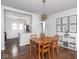 Dining room showcasing hardwood floors, unique light fixture, and decorative wall art at 1617 E 52Nd St, Indianapolis, IN 46205