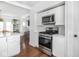 Stainless steel appliances in an open kitchen with views to the living area at 1617 E 52Nd St, Indianapolis, IN 46205
