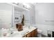 Bright bathroom with double sinks, large mirror, and modern fixtures at 17233 Gunther Blvd # 102B, Westfield, IN 46074