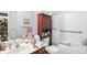 Well-lit bathroom featuring a vanity, dark wood cabinet, and accessible tub with grab bar at 17233 Gunther Blvd # 102B, Westfield, IN 46074