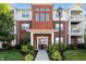 Beautiful condo building showcasing brick facade, covered entryway, and well-maintained landscaping at 17233 Gunther Blvd # 102B, Westfield, IN 46074