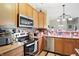 Well-equipped kitchen with stainless steel appliances and generous counter space, ready for culinary adventures at 17233 Gunther Blvd # 102B, Westfield, IN 46074