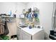 Practical laundry room with modern washer and dryer, providing ample storage space for cleaning supplies at 17233 Gunther Blvd # 102B, Westfield, IN 46074