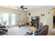 Comfortable living room featuring a ceiling fan and access to the outdoors, providing a relaxed atmosphere at 17233 Gunther Blvd # 102B, Westfield, IN 46074