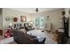 Spacious living room featuring plush seating, a ceiling fan, and a door to the outdoor space at 17233 Gunther Blvd # 102B, Westfield, IN 46074