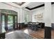 Lobby area featuring modern design with black and white tones, a round table, and an exterior door at 17233 Gunther Blvd # 102B, Westfield, IN 46074