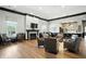 Lounge area with comfortable chairs, fireplace, TV, and kitchenette, offering a relaxing community space at 17233 Gunther Blvd # 102B, Westfield, IN 46074