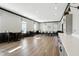 Large meeting room with modern decor, tables, chairs, and a sleek kitchenette area with white countertops at 17233 Gunther Blvd # 102B, Westfield, IN 46074