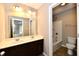 Bathroom featuring a double vanity with dark wood cabinets and a combined tub and shower at 18726 Tillamook E Run, Noblesville, IN 46062